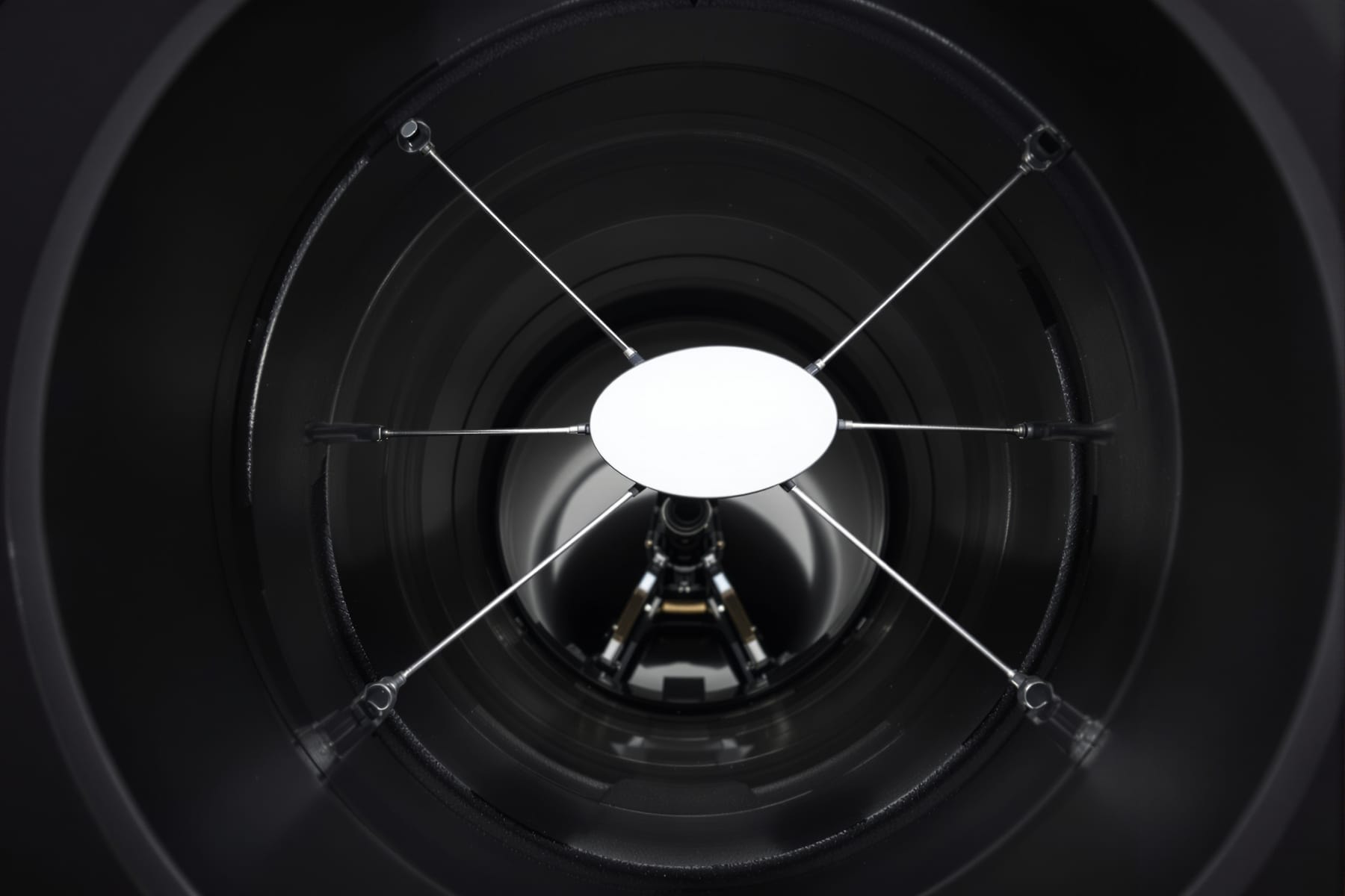 Looking into a Newtonian tube at the elliptical diagonal held by a four-vane spider